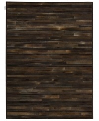 Western chic. Invite sumptuous style into your home with the one-of-a-kind Prairie rug from Calvin Klein. Tonal bars of rich cowhide are hand-tufted in an alternating pattern to create a stunning, mosaic-like appearance and a divinely textured feel. Western chic. Invite sumptuous style into your home with the one-of-a-kind Prairie rug from Calvin Klein. Tonal bars of rich cowhide are hand-tufted in an alternating pattern to create a stunning, mosaic-like appearance and a divinely textured feel.