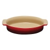 This durable and attractive stoneware features rimmed sides for ease in gripping and serving. Versatile and convenient, it is oven and microwave safe, and moves from refrigerator to oven to table with ease. A colorful expression of your good taste, its classic design lends a distinctive charm to any table.