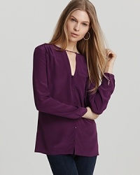 What a gem! This silk French Connection top is rendered with a deep front keyhole and brass buttons through the front for a luxe look that instantly elevates everything from staple pencil pants to skinny jeans. What a gem! This silk French Connection top is rendered with a deep front keyhole and brass buttons through the front for a luxe look that instantly elevates everything from staple pencil pants to skinny jeans.