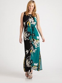 A brilliant floral print in muted hues gives this maxi dress with a waist-defining, self-tie belt a simply elegant look. You will certainly turn heads in this ultra-flattering design.Round necklineSleevelessSelf-tie beltButton closure at keyhole backAbout 43 from natural waist95% polyester/5% elastaneMachine washImported