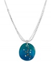 The subtle shine of crystals float on the blue sea hues of this Kenneth Cole New York resin pendant necklace. Includes a crystal cup chain accent. Crafted in silver tone mixed metal. Approximate length: 15 inches + 3-inch extender. Approximate drop: 1-1/2 inches.