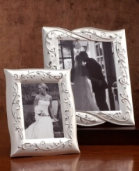 Showcase your treasured memories with a true treasure! The Opal Innocence frame features a delicate vine pattern accented by matte and polished silver. Showcase your treasured memories with a true treasure! The Opal Innocence frame features a delicate vine pattern accented by matte and polished silver.