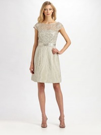 The beautiful sheen of moiré, crowned with a metallic lace bodice and banded with a sequined waistband.Jewel necklineCap sleevesMetallic lace bodiceConcealed back zip with keyhole hook-and-eye closureSequined waistbandMoiré skirtSilk liningAbout 23 from natural waistViscoseDry cleanImportedModel shown is 5'10 (177cm) wearing US size 4. The beautiful sheen of moiré, crowned with a metallic lace bodice and banded with a sequined waistband.Jewel necklineCap sleevesMetallic lace bodiceConcealed back zip with keyhole hook-and-eye closureSequined waistbandMoiré skirtSilk liningAbout 23 from natural waistViscoseDry cleanImportedModel shown is 5'10 (177cm) wearing US size 4.