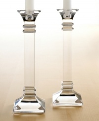 A modern take on a classic design, these crystal candlesticks feature sleek lines and sharp, precise edges that converge on a substantial base. In clear lead crystal. A modern take on a classic design, these crystal candlesticks feature sleek lines and sharp, precise edges that converge on a substantial base. In clear lead crystal.