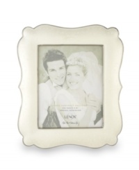 Capture your most magical moments with this large, porcelain frame. Scalloped edges and a luminous finish combine for a truly elegant effect. Capture your most magical moments with this large, porcelain frame. Scalloped edges and a luminous finish combine for a truly elegant effect.