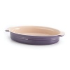 Handcrafted from durable stoneware and boasting 14 of cooking space, this bright Le Creuset oval dish takes your cooking from freezer to oven to table in classic style while a flared rim cuts down on spillage.