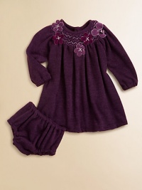 Plush, long-sleeve style with a smocked neckline and pretty flowers for an extra special touch. Round neckSmocked necklineLong sleeves with elastic cuffsButton back92% polyester/8% spandexHand wash or dry cleanImported Plush, long-sleeve style with a smocked neckline and pretty flowers for an extra special touch. Round neckSmocked necklineLong sleeves with elastic cuffsButton back92% polyester/8% spandexHand wash or dry cleanImported
