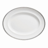 Vera Wang introduces Flirt fine bone china dinnerware. This platinum banded pattern features a modern scallop lace motif and a contemporary take on traditional lace work. Decoration on the inner verge of the accent plate, bread and butter and tea saucer adds a flirtatious touch of whimsy.