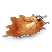 The artfully carved interior of this bowl from Julia Knight creates a dimensional sculpture inspired by the oak leaf. Handmade in sandcast aluminum decorated with a trademark blend of enamel infused with crushed mother of pearl. The artfully carved interior of this bowl from Julia Knight creates a dimensional sculpture inspired by the oak leaf. Handmade in sandcast aluminum decorated with a trademark blend of enamel infused with crushed mother of pearl.