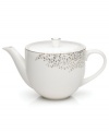 Fringed with shimmering leaves of platinum and mica, this bone china teapot turns your table into a springtime utopia. Its sleek shape and smooth lid are a vision of modern elegance in platinum-banded white.