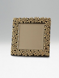 A regal, gold-plated garland, backed by Italian leather, frames your photo beautifully. Arrives elegantly gift boxed Imported
