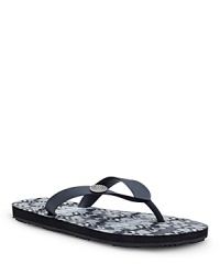 An ikat-printed footbed adds a worldly touch to a summer-comfort sandal from UGG® Australia.