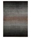 An ombré ground of soothing grays evokes mysterious allure in this area rug from Nourison. Hand tufted of long polyester fibers for added strength and softness, the Contour area rug creates an ideal accent for any modern room. (Clearance)