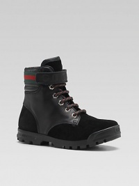 A rugged yet refined lace-up ankle style in a rich combination of suede and leather with signature green-red-green webbing.Lace-up frontLeather upperAnkle strap with engraved Gucci logo and webbed detailRubber soleMade in Italy A rugged yet refined lace-up ankle style in a rich combination of suede and leather with signature green-red-green webbing.Lace-up frontLeather upperAnkle strap with engraved Gucci logo and webbed detailRubber soleMade in Italy