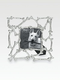 A whimsical frame inspired by the most important members of the family (and the treats they love), crafted with a lattice of dog bones in nickelplated stainless steel. Fits a 3 X 3 photographOverall, 6½ X 6½ totalImported A whimsical frame inspired by the most important members of the family (and the treats they love), crafted with a lattice of dog bones in nickelplated stainless steel. Fits a 3 X 3 photographOverall, 6½ X 6½ totalImported