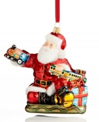 Santa takes great care to test-drive all the toys in his workshop, playing the role of conductor in this merrymaking ornament, handcrafted of Polonaise glass. By Kurt Adler. Santa takes great care to test-drive all the toys in his workshop, playing the role of conductor in this merrymaking ornament, handcrafted of Polonaise glass. By Kurt Adler.
