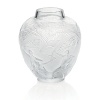 Originally designed by René Lalique in 1921, this large vase depicts archers in traditional Art Deco style. From Lalique.