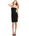 Calvin Klein's cocktail dress features a flattering stretch blend that accentuates your curves in all the right places. A textured skirt adds intrigue to the solid-hued strapless silhouette.