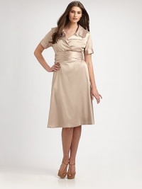 An elegant stretch satin design inspired by the classic trench coat. Collar neckShort sleevesButton-detail cuffsSelf-tie at waistAbout 25 from natural waist55% polyester/42% rayon/3% spandexDry cleanMade in USA of imported fabric An elegant stretch satin design inspired by the classic trench coat. Collar neckShort sleevesButton-detail cuffsSelf-tie at waistAbout 25 from natural waist55% polyester/42% rayon/3% spandexDry cleanMade in USA of imported fabric