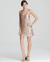 Shimmering pink sequins are the confection of the season and they arrive in high style on this French Connection dress. Make a maximum impact in this mini by pairing the shiner with towering metallic stilettos.