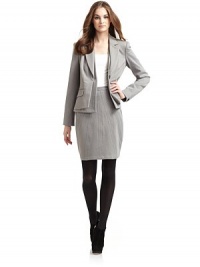 THE LOOKNotched lapelsFront button closure with layered-look frontLong button cuff sleevesTwo front flap pocketsPrincess seamsBack ventTHE FITAbout 22½ from shoulder to hemTHE MATERIAL87% viscose/8% nylon/5% spandexFully linedCARE & ORIGINDry cleanMade in USA THE LOOKNotched lapelsFront button closure with layered-look frontLong button cuff sleevesTwo front flap pocketsPrincess seamsBack ventTHE FITAbout 22½ from shoulder to hemTHE MATERIAL87% viscose/8% nylon/5% spandexFully linedCARE & ORIGINDry cleanMade in USA