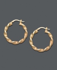 Add a rich twist to your look. Traditional hoops offer a special touch with a unique twisted design crafted in 14k gold. Approximate diameter: 1-1/4 inches. Add a rich twist to your look. Traditional hoops offer a special touch with a unique twisted design crafted in 14k gold. Approximate diameter: 1-1/4 inches.