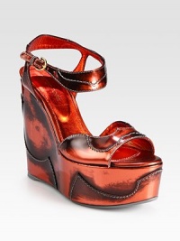 An ultra-high wedge and contrast stitching defines this lust-worthy design of searing metallic leather. Self-covered wedge, 5¼ (130mm)Covered platform, 2 (50mm)Compares to a 3¼ heel (80mm)Metallic leather upperAdjustable ankle strapLeather liningRubber solePadded insoleMade in SpainOUR FIT MODEL RECOMMENDS ordering one size up as this style runs small. An ultra-high wedge and contrast stitching defines this lust-worthy design of searing metallic leather. Self-covered wedge, 5¼ (130mm)Covered platform, 2 (50mm)Compares to a 3¼ heel (80mm)Metallic leather upperAdjustable ankle strapLeather liningRubber solePadded insoleMade in SpainOUR FIT MODEL RECOMMENDS ordering one size up as this style runs small.