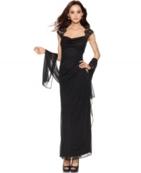 Xscape's dress is made captivating with lace cap sleeves and an elegant sheer shawl to drape at your arms. Xscape's dress is made captivating with lace cap sleeves and an elegant sheer shawl to drape at your arms.