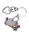 Simply charming. Inspired by the iconic Daydreamer bag, this Juicy Couture key fob will keep you exquisitely organized. Featuring a rhinestone embellished Daydreamer bag, signature heart and logo-embossed key ring, it's the perfect way to showcase your love for luxe.