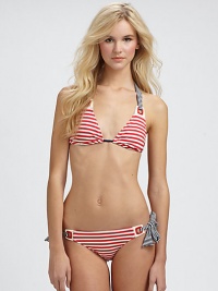 A striped delight with grommet details that connect the unique halter strap ties to triangle cups.Halter strap ties at neckRemovable soft cupsBack tie closure82% nylon/18% spandexFully linedHand washImported Please note: Bikini bottom sold separately. 