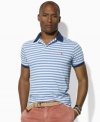Vibrant pops of color and Ralph Lauren's iconic pony enliven a trim-fitting short-sleeved polo crafted from soft jersey-knit cotton with sleek stripes.