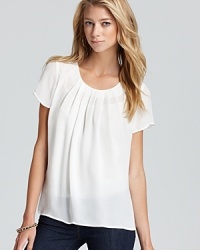 Our new Joie top is a simple statement maker crafted from pure silk with classic pleats for an elegant look that stands on its own, or beneath a blazer, beautifully. Our new Joie top is a simple statement maker crafted from pure silk with classic pleats for an elegant look that stands on its own, or beneath a blazer, beautifully.