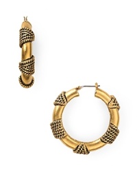 Bolder is better: T Tahari models statement style with this pair of gold-plated hoop earrings, wrapped in ropey detailing. Bolder is better: T Tahari models statement style with this pair of gold-plated hoop earrings, wrapped in ropey detailing.