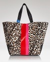 Work an exotic vibe with this tote from Juicy Couture. An updated take of the brand's much loved day bag, this glam style flaunts bold spots and cool color blocked detailing.