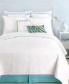 Coordinate your Santorini White bed from Trina Turk with this decorative pillow, featuring a green border with a tufted covered button at the center.