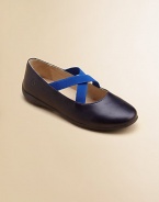 A cozy elastic cross strap keeps her feet in place when she's wandering around in these adorable leather slip-ons.Elastic cross strap slip-onLeather upperLeather liningRubber solePadded insoleImported