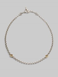 A bold sterling silver chain is accented by cloverleaf shapes of 18k gold in front and sterling silver at the closure. Sterling silver and 18k yellow gold Length, about 18 Toggle closure Made in Greece