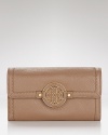 Cast in rich leather with a simple, streamlined shape, this practical piece from Tory Burch is an effortless choice for organizing the essentials.
