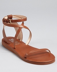 A low-key flat sandal for warm-weather adventures. From KORS Michael Kors. A low-key flat sandal for warm-weather adventures. From KORS Michael Kors.