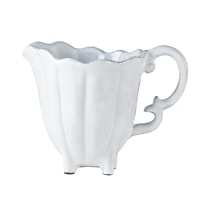 Handmade from Venetian terra marrone, or brown clay, this scalloped creamer brings a rustically sophisticated note to your table. Handmade from Venetian terra marrone, or brown clay, this scalloped creamer brings a rustically sophisticated note to your table.