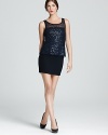 A sheer, sequined peplum overlay showcases the season's love of ladylike sparkle. From Bailey 44.