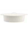A bread basket woven of crisp white porcelain with embossed detail lends easy elegance to casual meals. From Martha Stewart Collection.