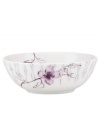 Blur the line between garden style and modern design with the Watercolors Amethyst bowl. Purple blossoms flourish against a playful dot pattern while the white coupe shape couples the sleek look and unparalleled durability of bone china. (Clearance)