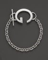 This sterling silver toggle bracelet bears Gucci's signature G.