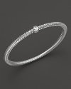 A single diamond station shines on this modern 18K white gold mesh bangle from Roberto Coin.