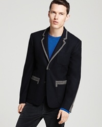MARC BY MARC JACOBS brings wit to your wardrobe with this clever blazer, featuring cool contrasts at the collar, pockets and back of the sleeves for fun designer flair. MARC BY MARC JACOBS brings wit to your wardrobe with this clever blazer, featuring cool contrasts at the collar, pockets and back of the sleeves for fun designer flair.