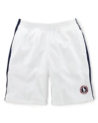 A preppy short rendered from soft cotton mesh is accented with side-seam stripes and a signature Ralph Lauren pony emblem, celebrating Team USA's participation in the 2012 Olympics. A preppy short rendered from soft cotton mesh is accented with side-seam stripes and a signature Ralph Lauren pony emblem, celebrating Team USA's participation in the 2012 Olympics.