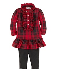 Traditional cotton plaid is sweetly adorned with a flurry of ruffles to coordinate perfectly with comfy stretch leggings. Traditional cotton plaid is sweetly adorned with a flurry of ruffles to coordinate perfectly with comfy stretch leggings.