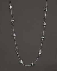 This bold sterling silver station necklace, gleaming with rock crystal, is a brilliant showcase for Di MODOLO's iconic Triadra design.
