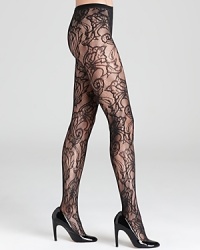 HUE combines a swirling floral print with fishnet tights for a luxe leg look. HUE combines a swirling floral print with fishnet tights for a luxe leg look.